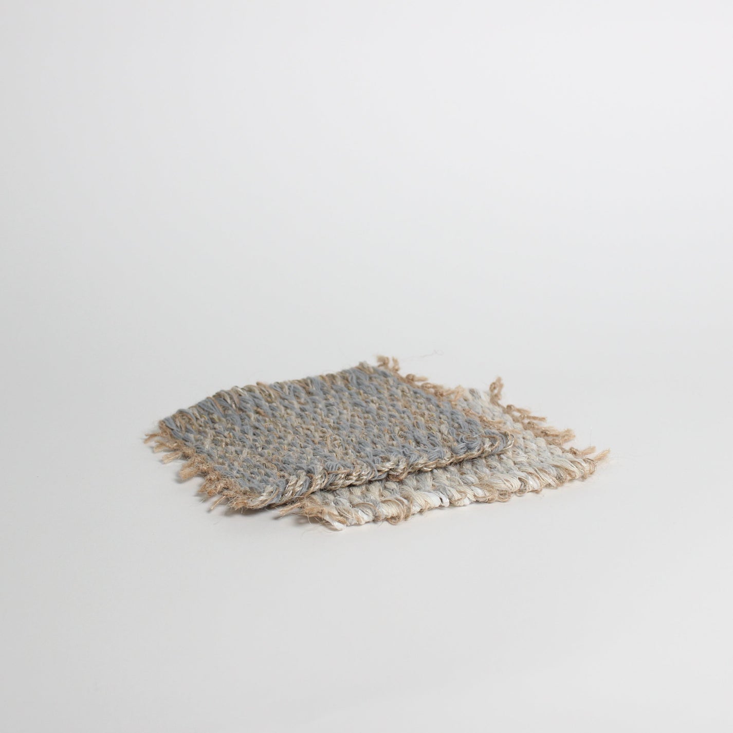 Hand-knitted tweed coaster set
