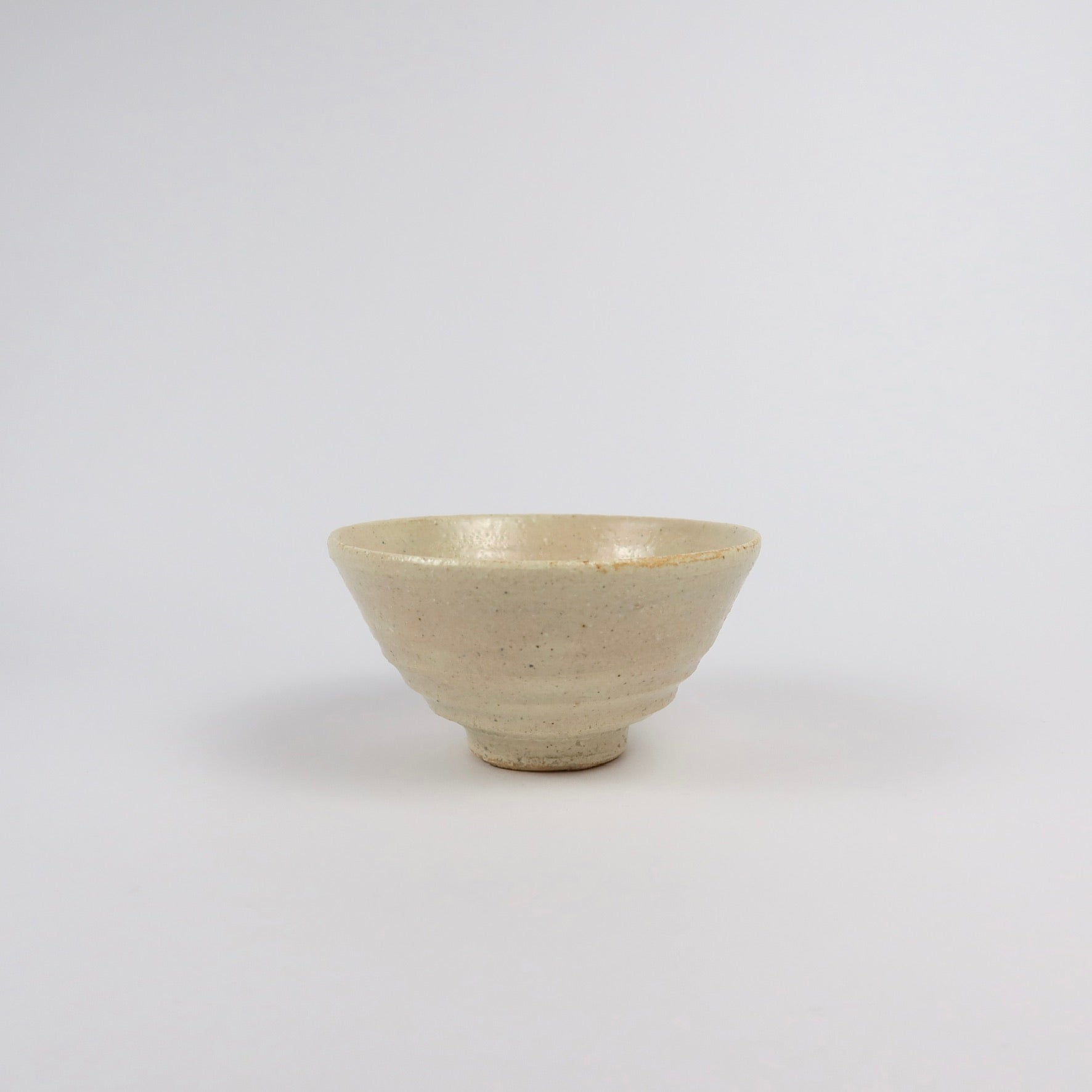 beige Korean ceramic matcha tea bowl with rokurome