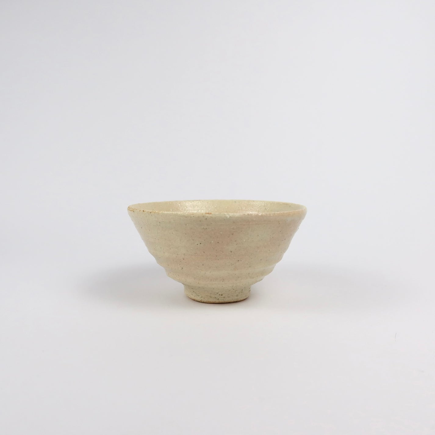 beige Korean ceramic matcha tea bowl with rokurome