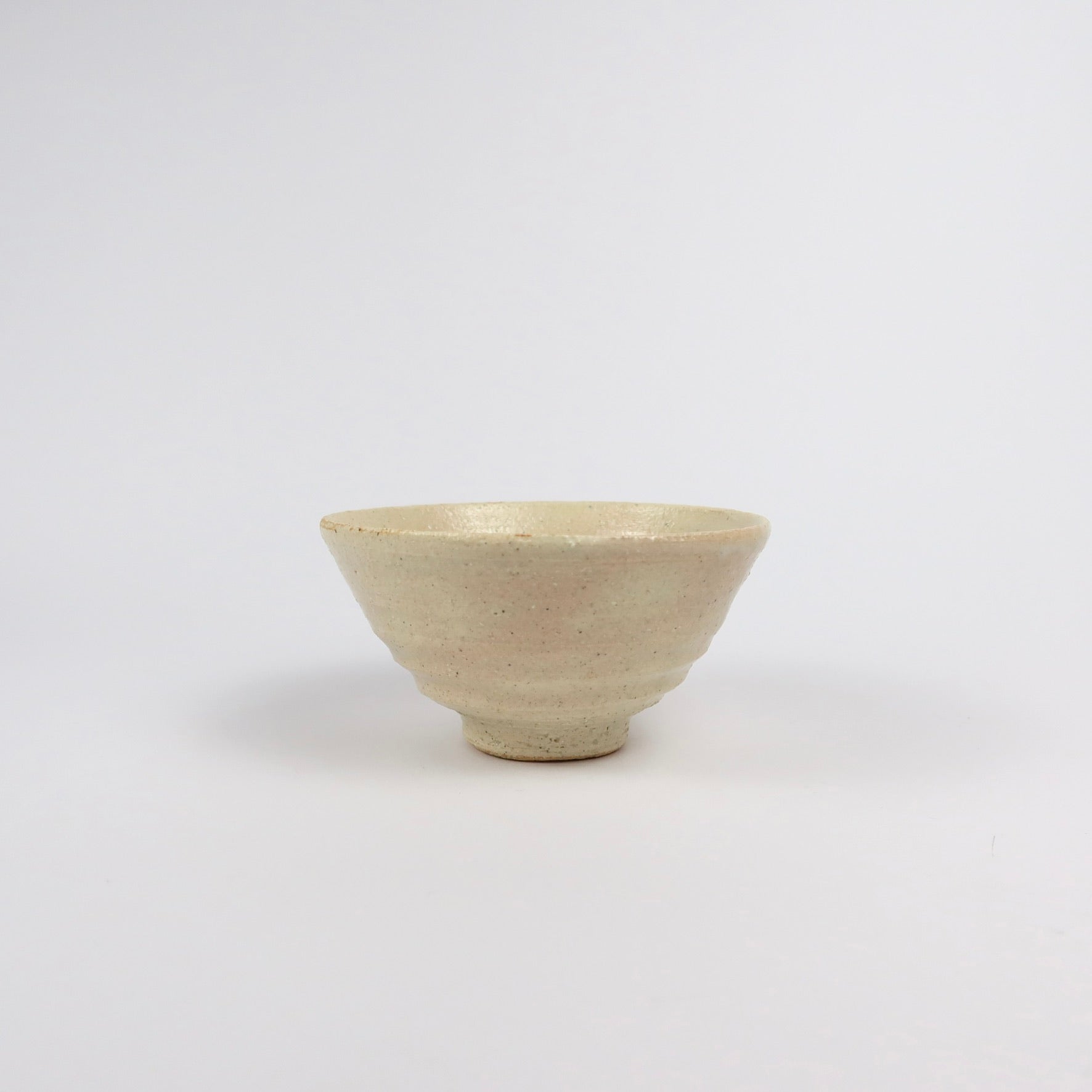beige Korean ceramic matcha tea bowl with rokurome