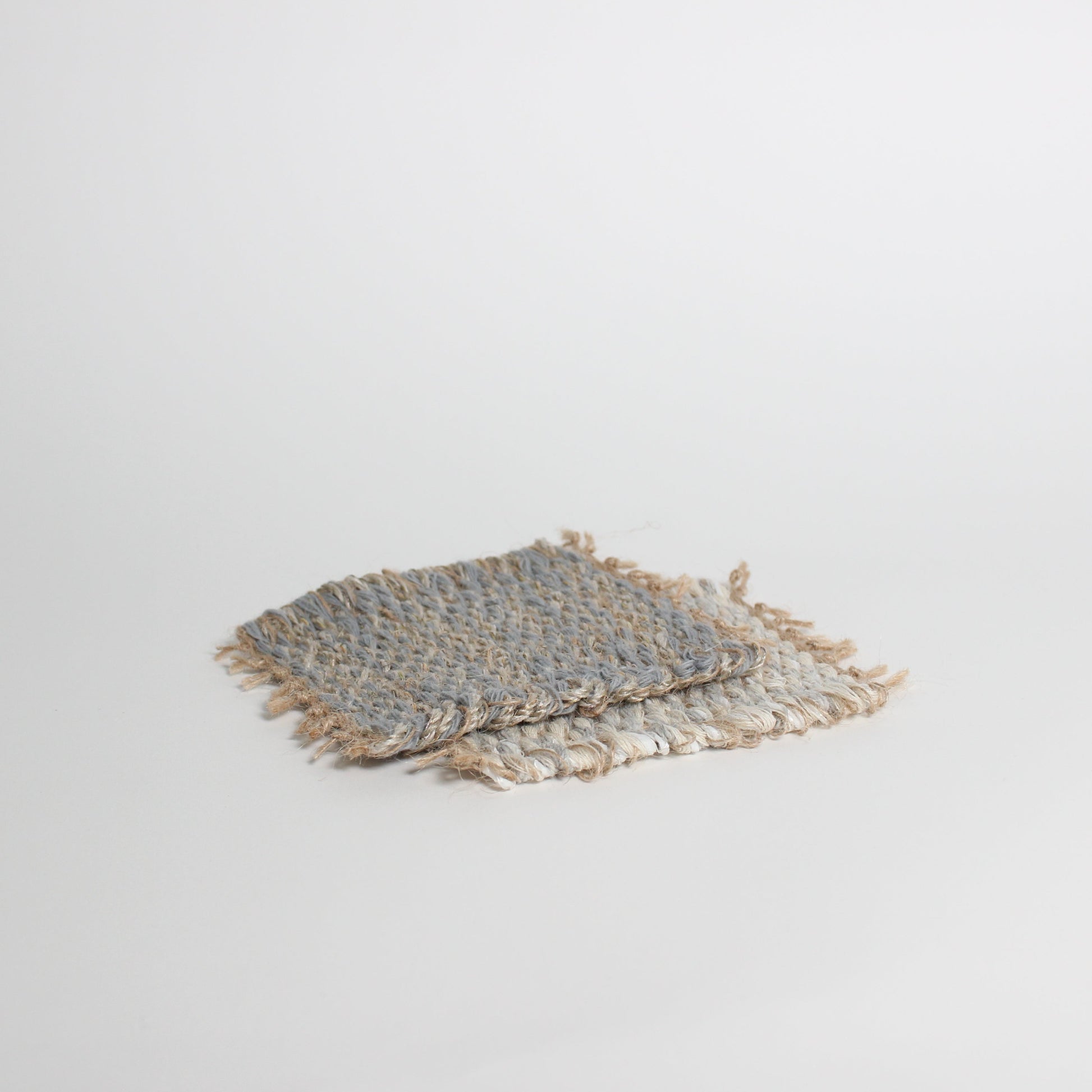 Hand-knitted tweed coaster set