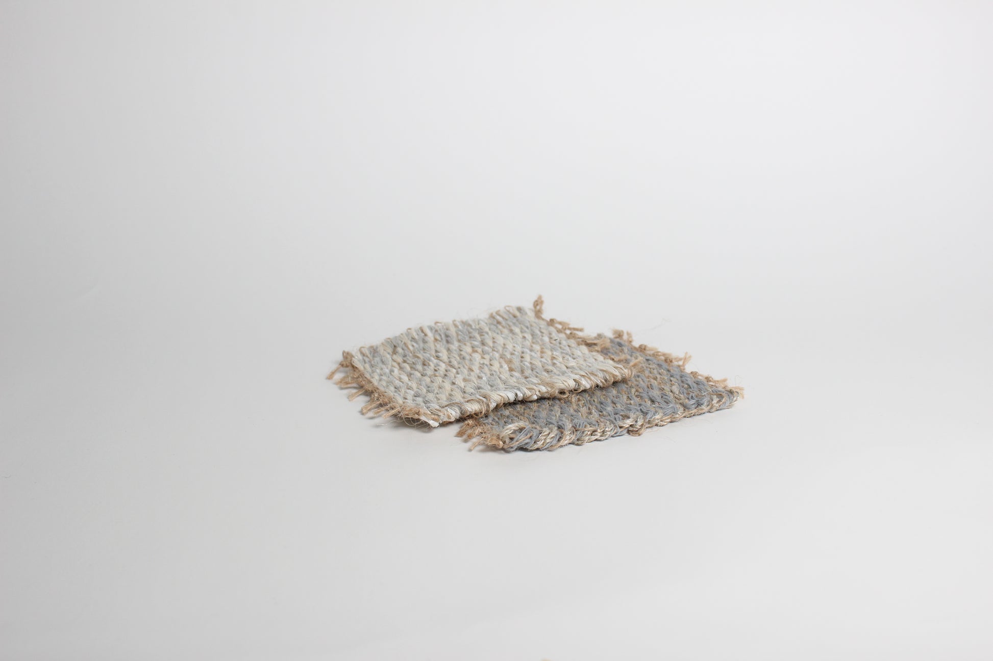 Hand-knitted tweed coaster set