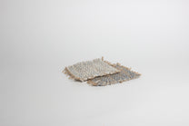 Hand-knitted tweed coaster set