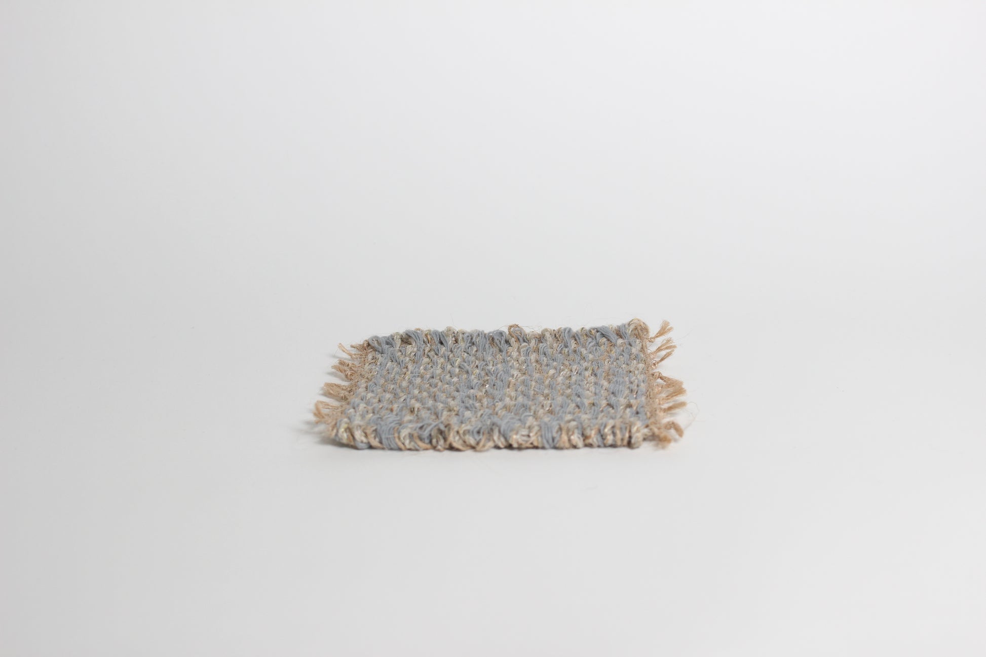 Hand-knitted tweed coaster set