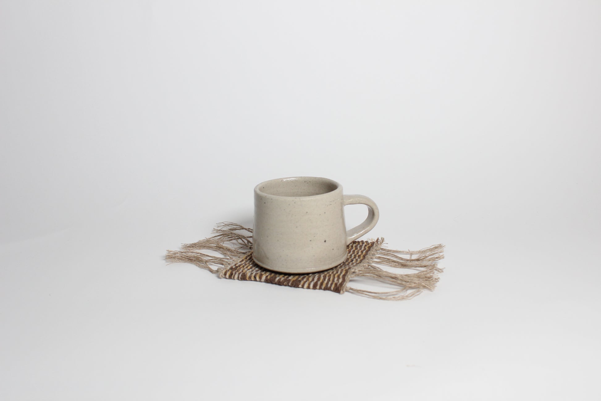 Hand-knitted tweed coaster, brown