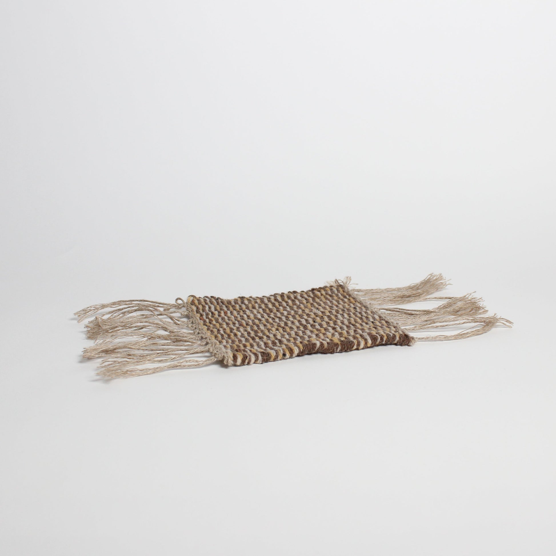 Hand-knitted tweed coaster, brown